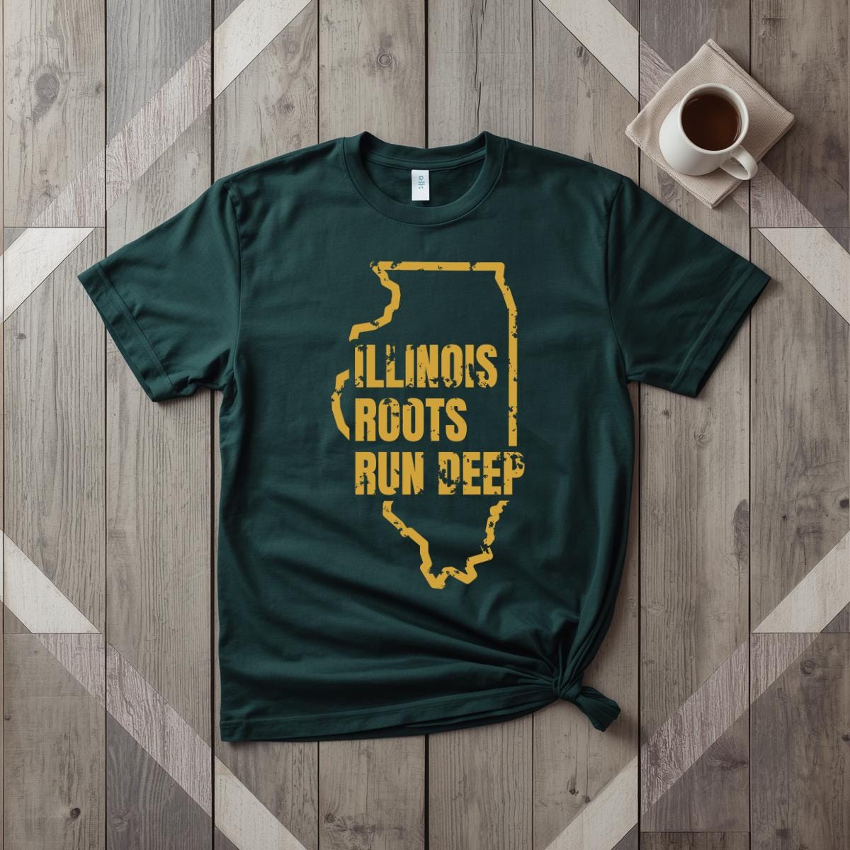 Illinois Roots Run Deep tee in forest green with mustard print, laid flat on weathered wood