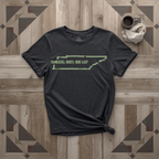 Tennessee Roots Run Deep tee in black with sage print, laid flat on weathered wood