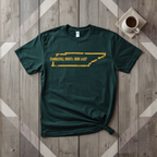 Tennessee Roots Run Deep tee in forest green with mustard print, laid flat on weathered wood