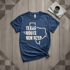 Texas Roots Run Deep tee in heather navy with cream print, laid flat on weathered wood